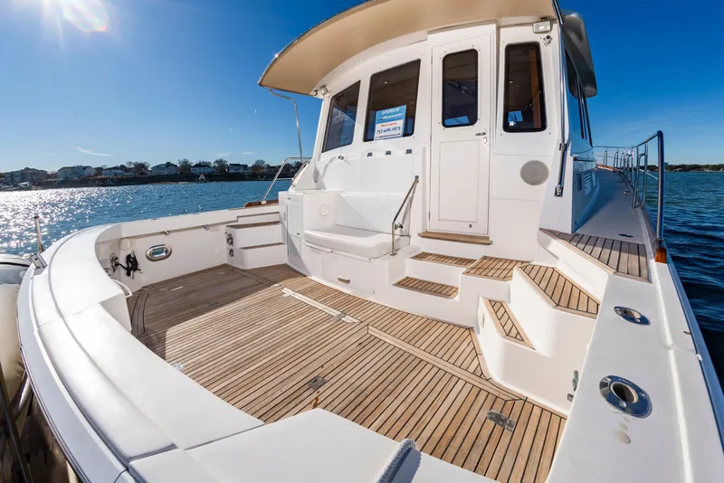 Slide: The Image of Grand Banks 49 Eastbay SX 2005 yacht on the water. - 10