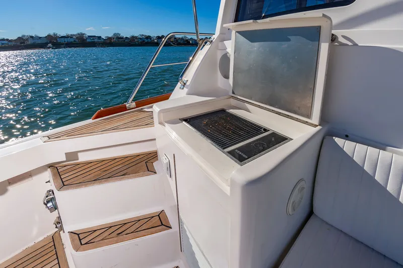 Slide: The Image of Grill area on a 2005 Grand Banks 49 Eastbay SX yacht. - 12
