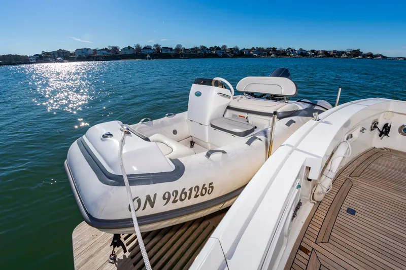 Slide: The Image of Grand Banks 49 Eastbay SX 2005 with dinghy on water. - 13