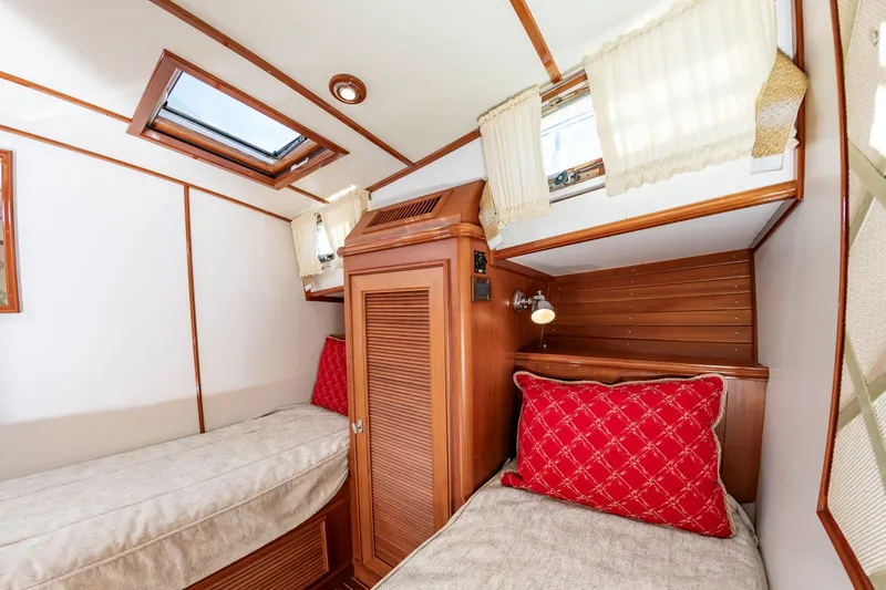 Slide: The Image of 2005 Grand Banks 49 Eastbay SX cabin interior with twin beds. - 49