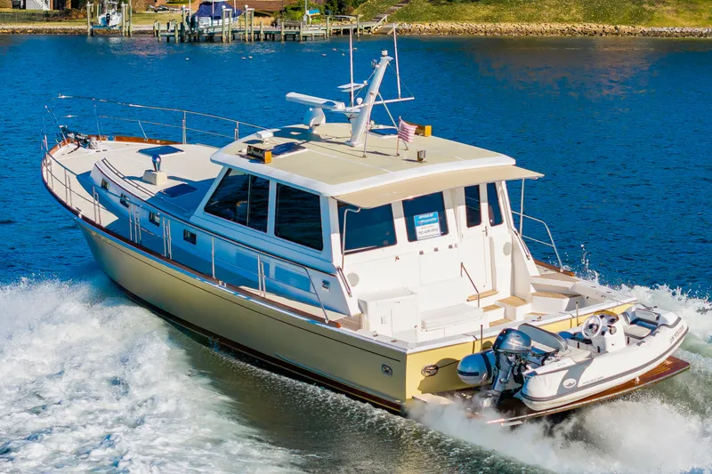 Slide: The Image of 2005 Grand Banks 49 Eastbay SX yacht cruising on water. - 5