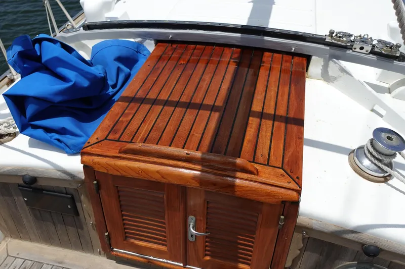 Slide: The Image of Polished wooden hatch on 1985 Tayana 37 Cutter sailboat deck. - 12