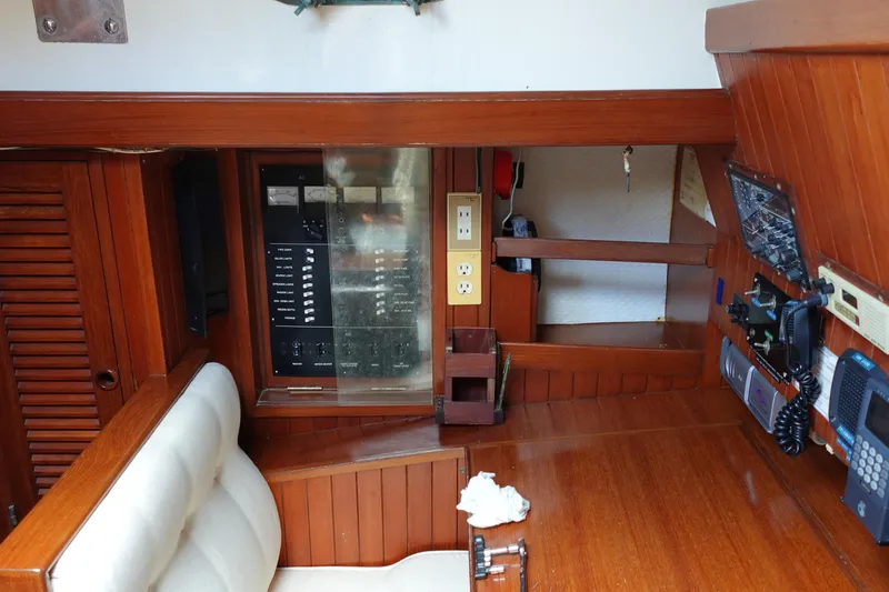 Slide: The Image of Interior of 1985 Tayana 37 Cutter sailboat with navigation equipment and control panel. - 18