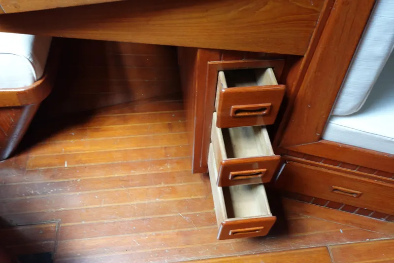 Slide: The Image of Wooden drawers in a 1985 Tayana 37 Cutter sailboat interior. - 20
