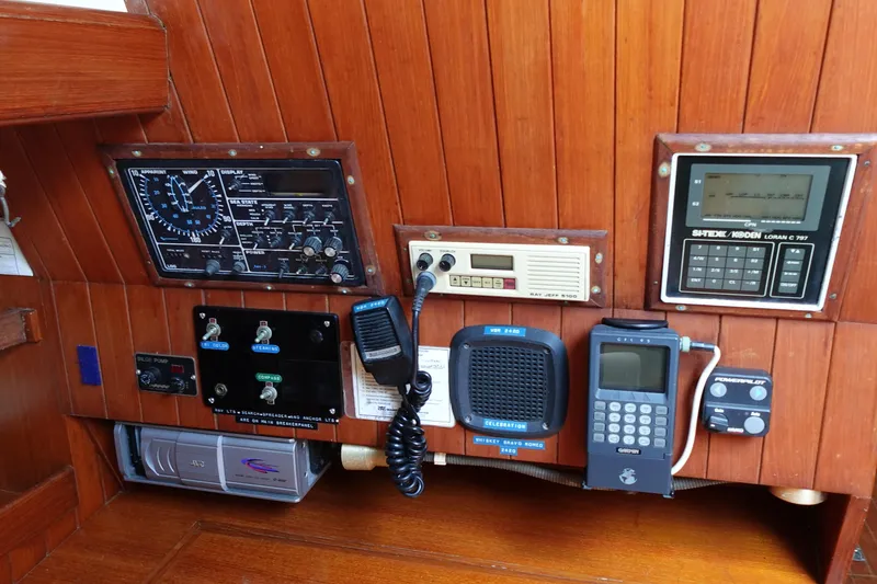 Slide: The Image of Control panel of a 1985 Tayana 37 Cutter sailboat with navigation and communication equipment. - 24