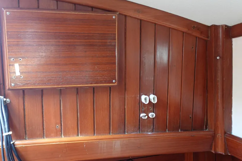 Slide: The Image of Wooden interior paneling of a 1985 Tayana 37 Cutter sailboat. - 30