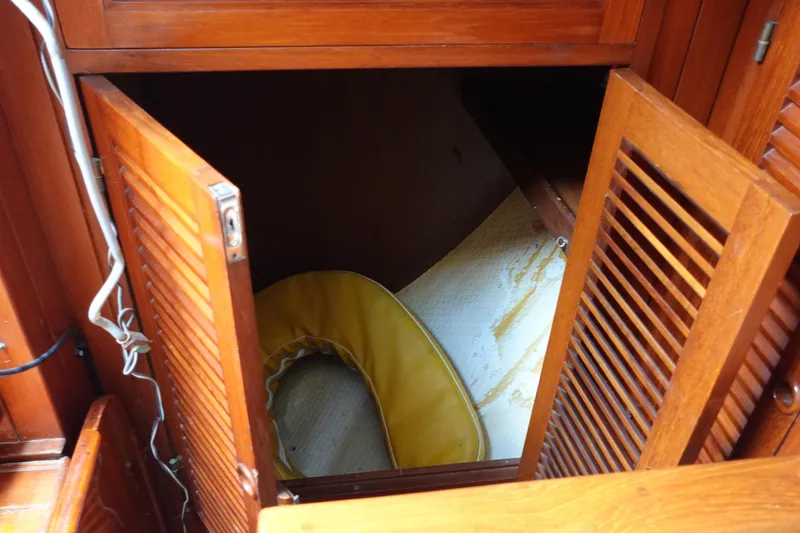 Slide: The Image of Wooden cabinet with open doors on a 1985 Tayana 37 Cutter sailboat. - 33