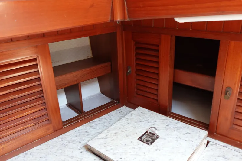 Slide: The Image of Wooden cabinetry and storage in 1985 Tayana 37 Cutter sailboat interior. - 36