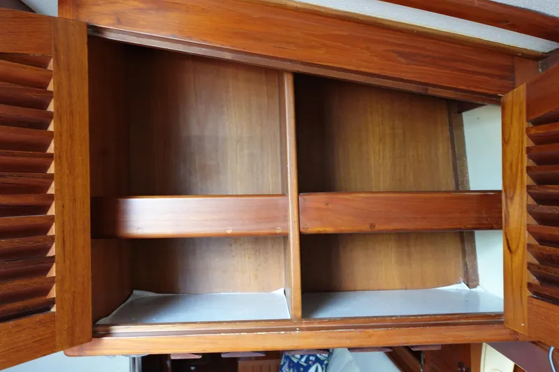 Slide: The Image of Wooden cabinet interior on 1985 Tayana 37 Cutter sailboat. - 46