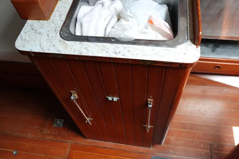 Slide: The Image of Wooden cabinet with marble countertop and sink on 1985 Tayana 37 Cutter yacht. - 49