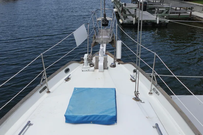 Slide: The Image of Bow view of 1985 Tayana 37 Cutter sailboat docked at marina. - 7