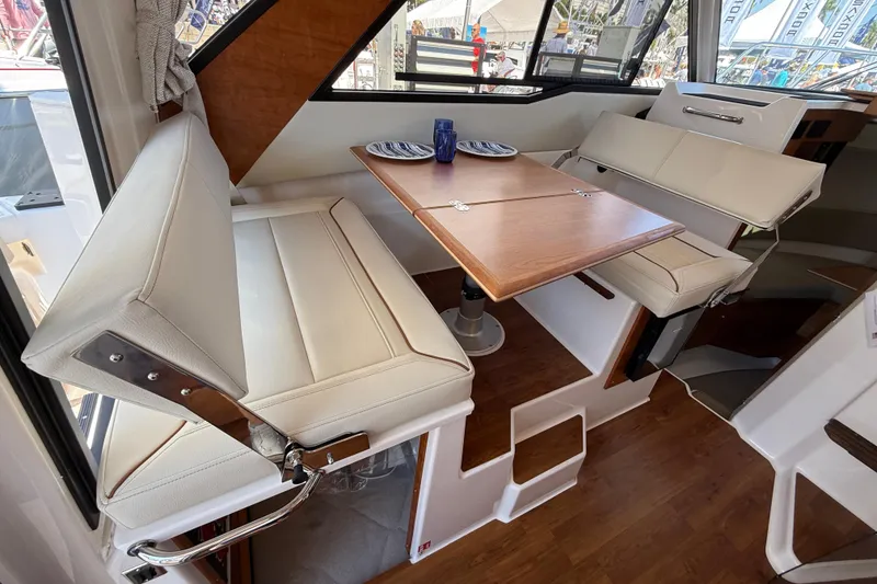 Slide: The Image of Interior of 2026 Cutwater C-288 CB boat with dining area and seating. - 10