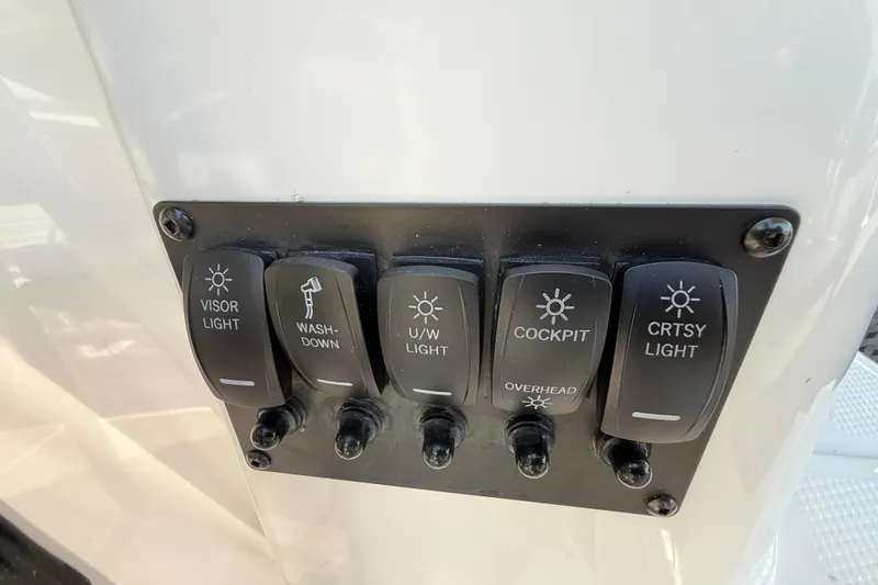 Slide: The Image of Switch panel on 2026 Cutwater C-288 CB boat, featuring various light controls. - 22