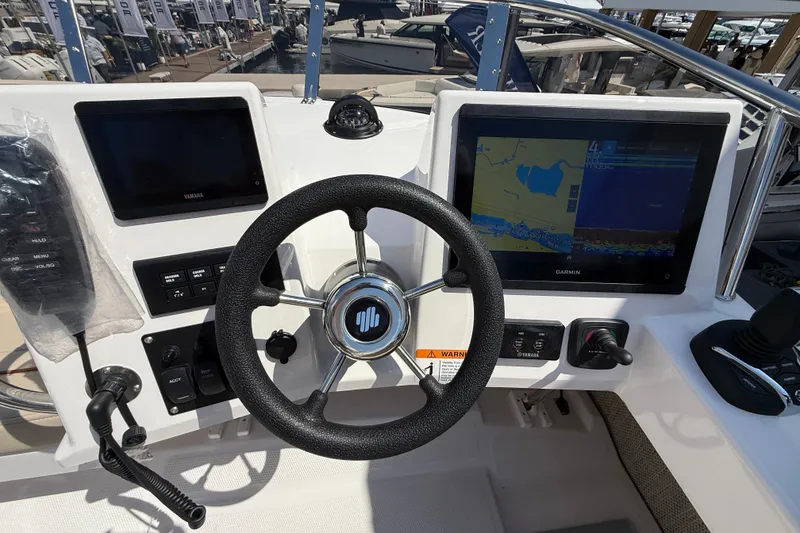 Slide: The Image of Steering console of 2026 Cutwater C-288 CB with Garmin navigation display. - 27