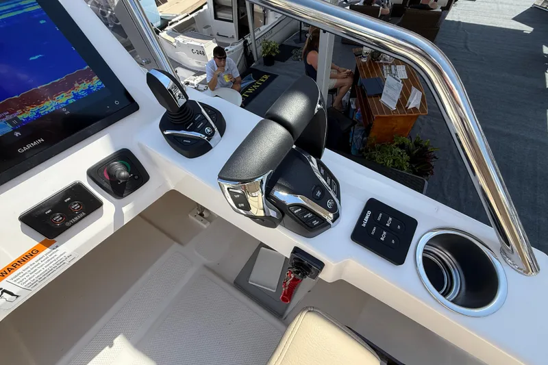 Slide: The Image of Helm controls of 2026 Cutwater C-288 CB boat with Garmin display and Yamaha controls. - 28