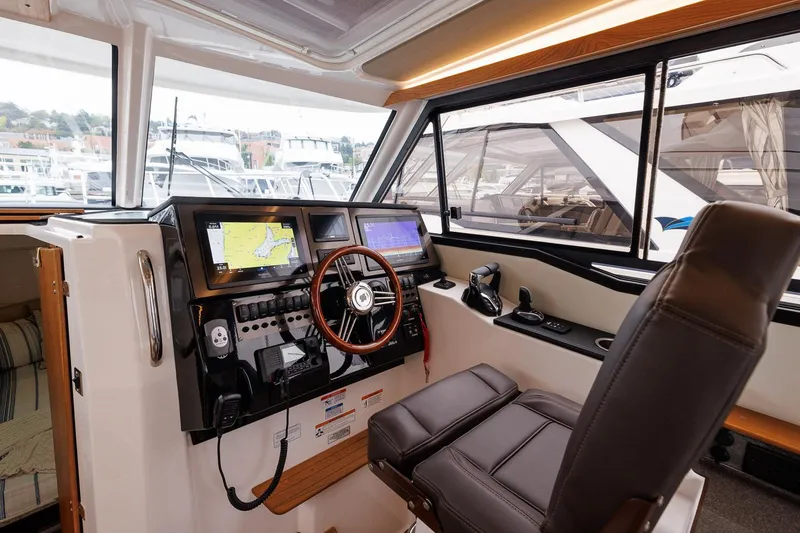 Slide: The Image of Manufacturer Provided Image: 2026 Cutwater C-288 CB helm with modern navigation displays and comfortable seating. - 6