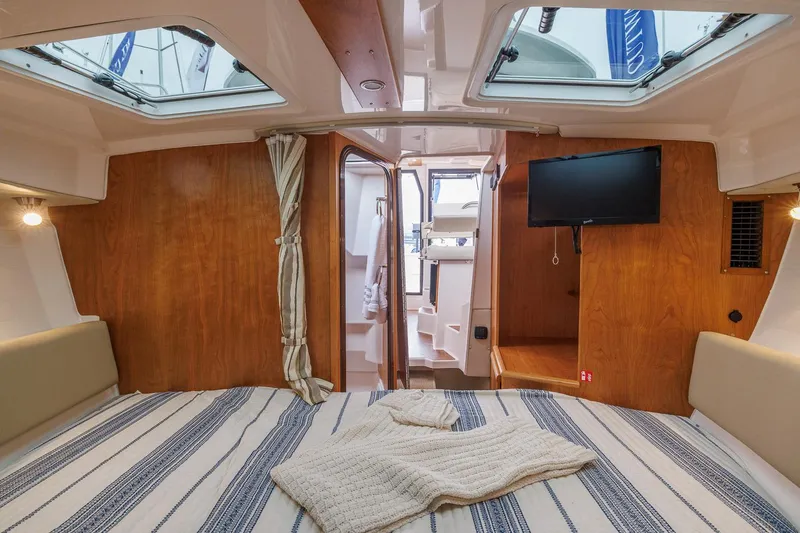 Slide: The Image of Manufacturer Provided Image: Interior of 2026 Cutwater C-288 CB boat with cozy cabin and modern amenities. - 7