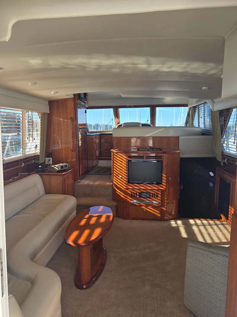 Slide: The Image of Interior of a 2005 Navigator 44C yacht with sofa and TV. - 22