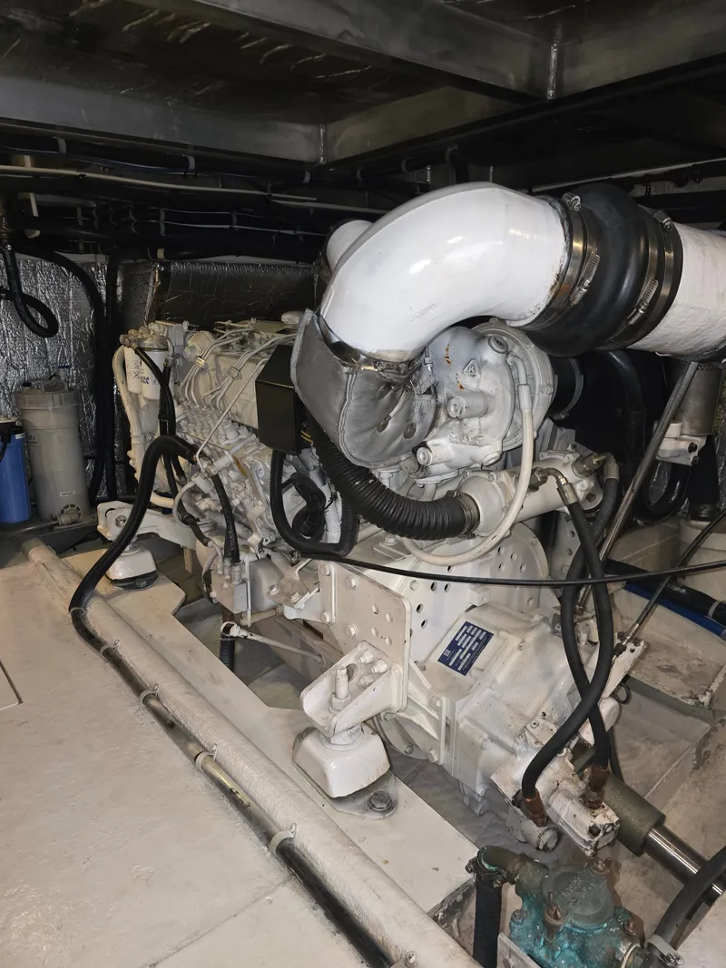 Slide: The Image of Engine room of a 2005 Navigator 44C with white engine. - 43