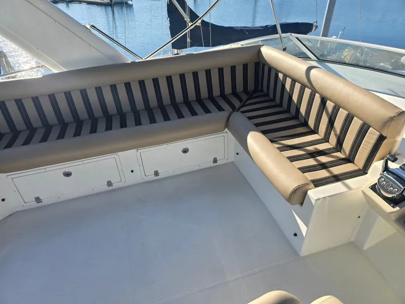 Slide: The Image of Interior of a 2005 Navigator 44C yacht with striped seating. - 9