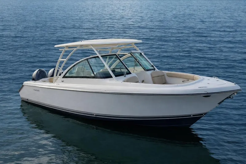 The Image of 2015 Pursuit DC 265 Dual Console boat on calm blue water. - 0