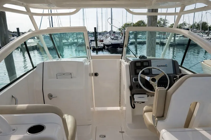 Slide: The Image of 2015 Pursuit DC 265 Dual Console boat dashboard with Garmin navigation system. - 8