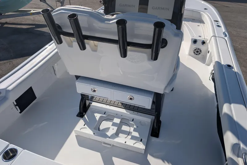 Slide: The Image of 2026 Tidewater 2500 Carolina Bay boat interior with rod holders and Garmin electronics. - 10