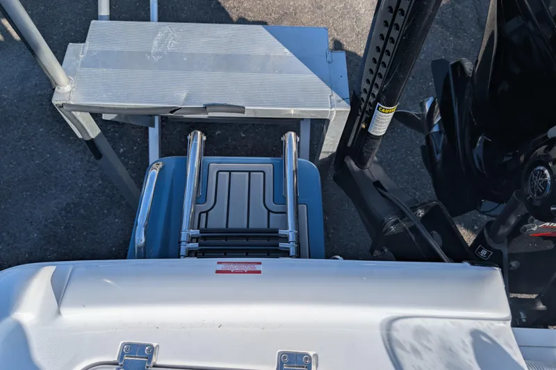 Slide: The Image of 2026 Tidewater 2500 Carolina Bay boat ladder and motor, viewed from above. - 16