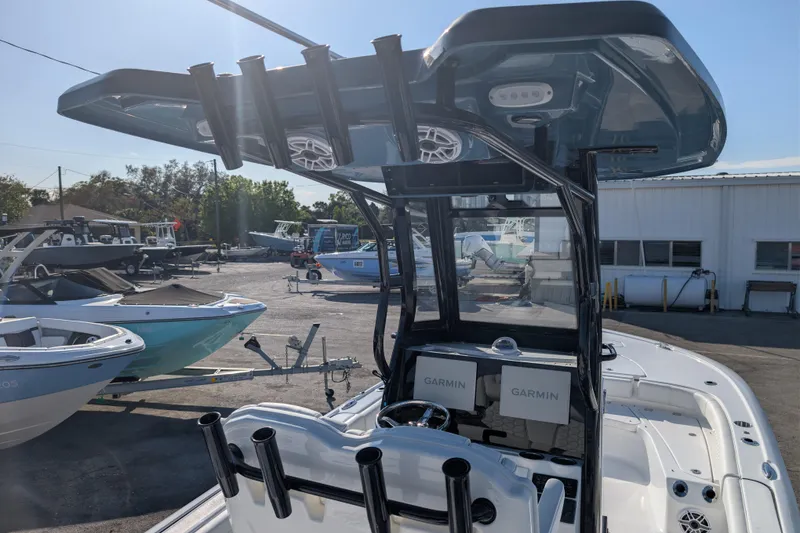 Slide: The Image of 2026 Tidewater 2500 Carolina Bay boat with Garmin electronics, docked outdoors. - 17