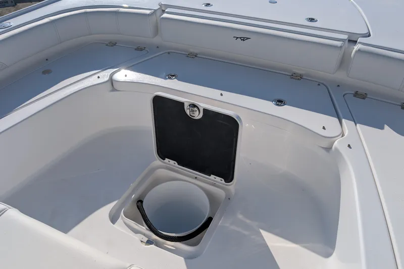 Slide: The Image of 2026 Tidewater 2500 Carolina Bay boat interior with storage compartment open. - 20