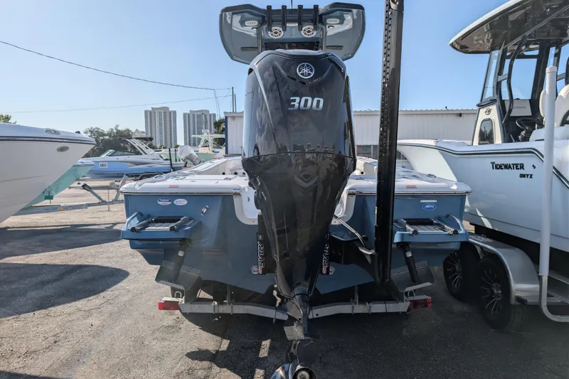 Slide: The Image of 2026 Tidewater 2500 Carolina Bay boat with Yamaha 300 engine, parked outdoors. - 24