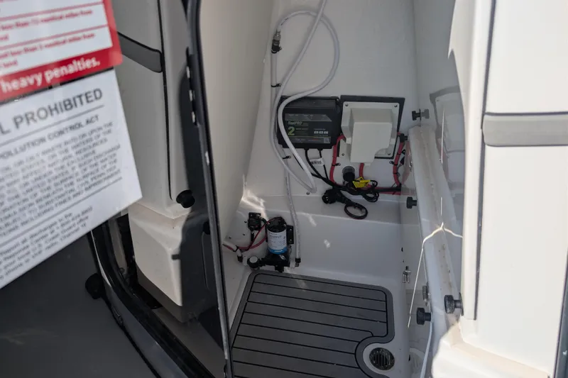Slide: The Image of Interior view of 2026 Tidewater 2500 Carolina Bay boat, showcasing electrical components and wiring. - 28