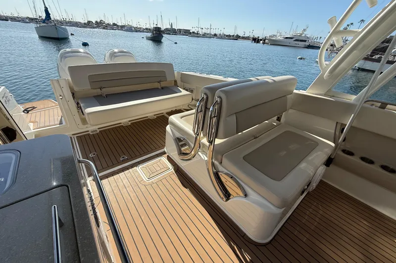 Slide: The Image of 2020 Boston Whaler 320 Vantage boat with foldable seating and teak flooring. - 18