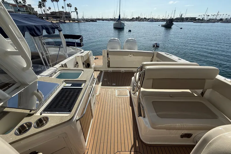 Slide: The Image of Outdoor kitchen on 2020 Boston Whaler 320 Vantage boat with grill and sink. - 25