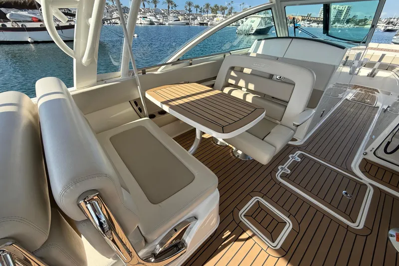 Slide: The Image of 2020 Boston Whaler 320 Vantage boat interior with seating and ocean view. - 26
