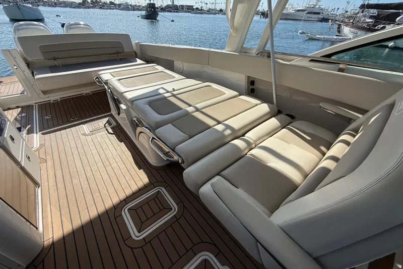 Slide: The Image of 2020 Boston Whaler 320 Vantage interior with luxurious seating and ocean view. - 30