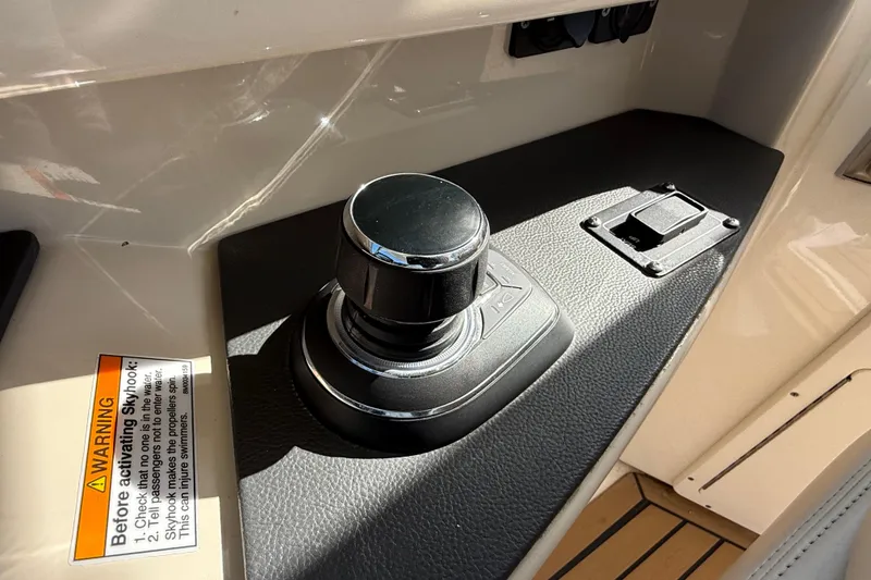 Slide: The Image of Control panel of a 2020 Boston Whaler 320 Vantage boat, featuring active trim and Lenco controls. - 41