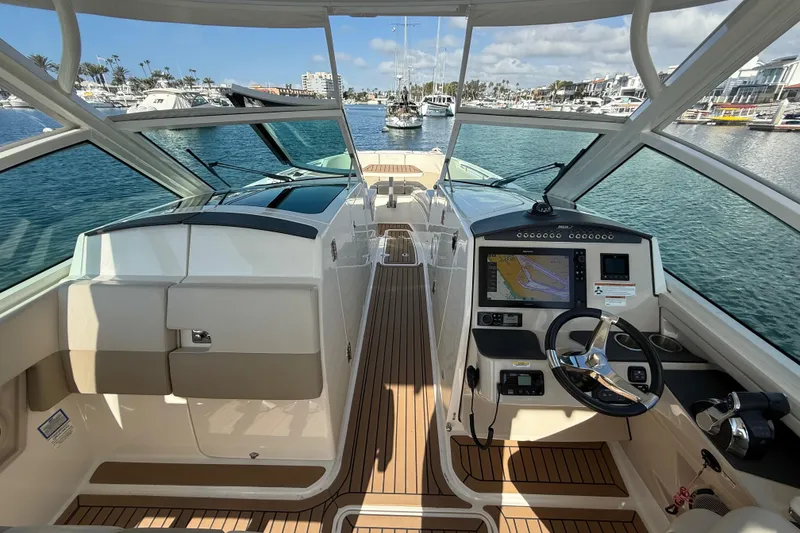 Slide: The Image of Control panel of a 2020 Boston Whaler 320 Vantage boat with joystick and warning label. - 42