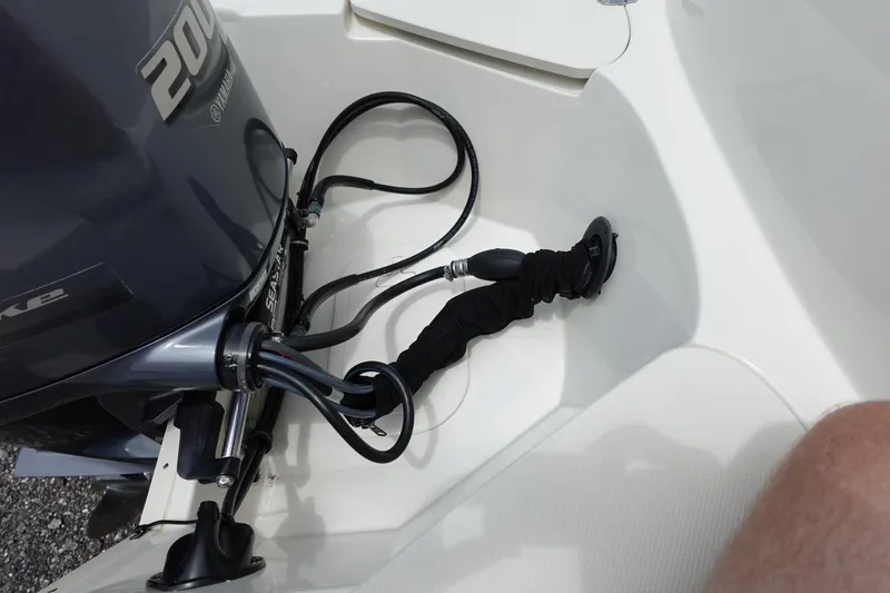 Slide: The Image of 2022 Stingray 231 DC boat with Yamaha 200 engine and visible wiring. - 19