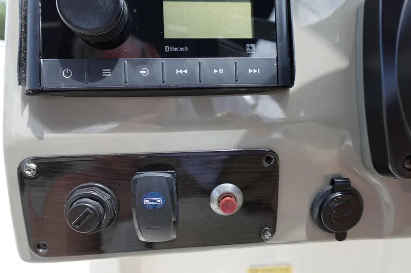 Slide: The Image of Control panel of 2022 Stingray 231 DC boat with Bluetooth and USB features. - 42