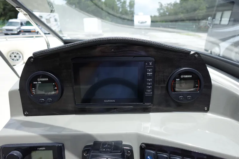 Slide: The Image of Dashboard of 2022 Stingray 231 DC boat with Garmin and Yamaha displays. - 9
