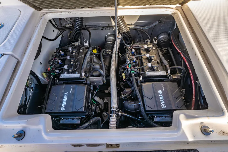 Slide: The Image of 2019 Yamaha Boats 210 FSH Sport engine compartment with dual engines visible. - 13