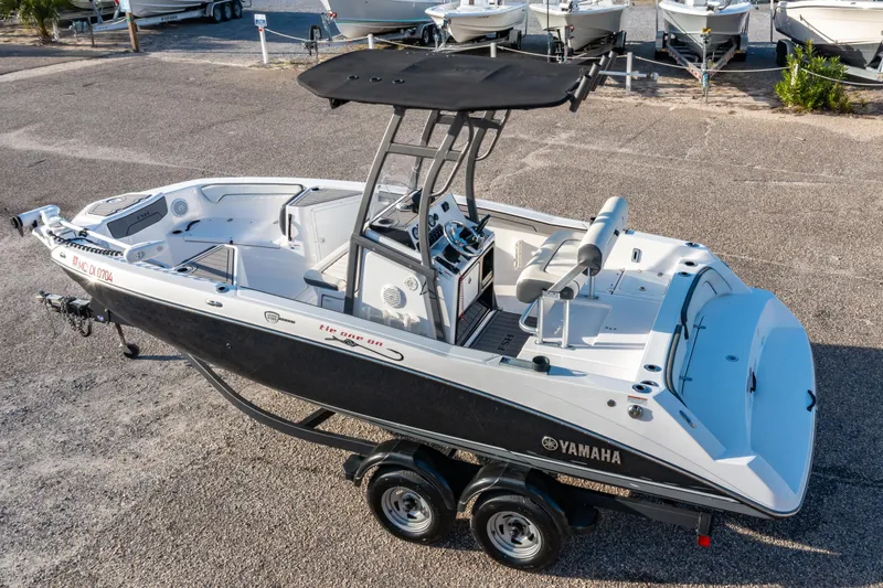 Slide: The Image of Overhead view of 2019 Yamaha Boats 210 FSH Sport on pavement. - 2