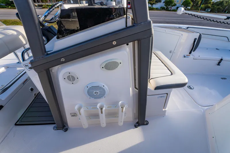 Slide: The Image of 2019 Yamaha Boats 210 FSH Sport interior with seating and rod holders. - 23