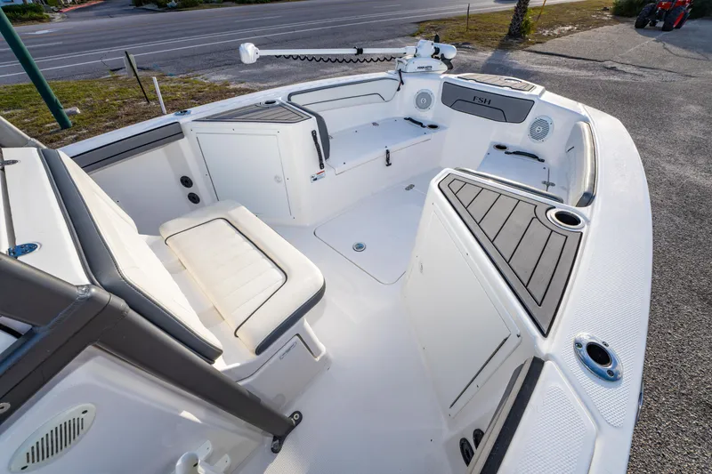 Slide: The Image of 2019 Yamaha Boats 210 FSH Sport interior with seating and storage compartments. - 24
