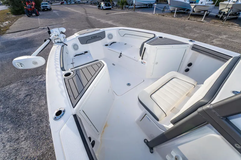 Slide: The Image of 2019 Yamaha Boats 210 FSH Sport interior, featuring seating and storage compartments. - 25
