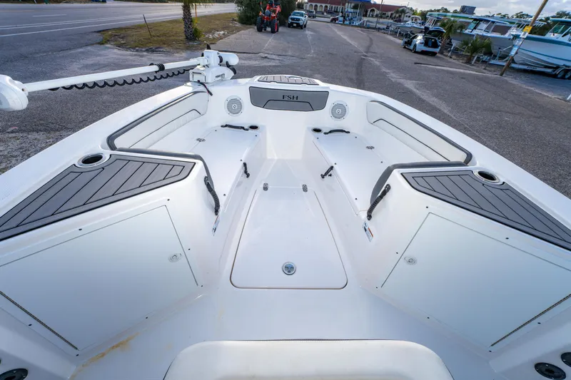 Slide: The Image of 2019 Yamaha Boats 210 FSH Sport interior, featuring spacious seating and storage compartments. - 26