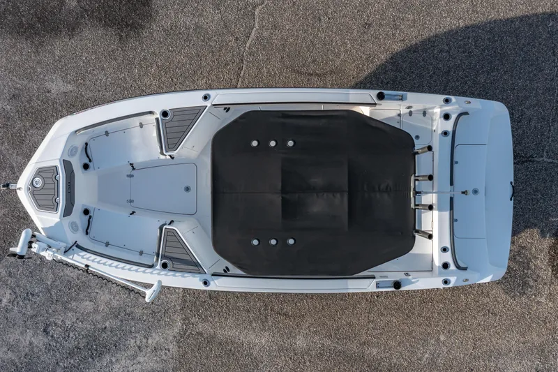 Slide: The Image of 2019 Yamaha Boats 210 FSH Sport on trailer, urban background, clear sky. - 3