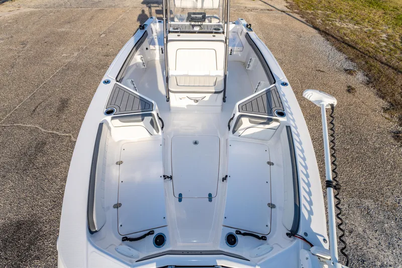 Slide: The Image of 2019 Yamaha Boats 210 FSH Sport interior, featuring spacious seating and storage compartments. - 30