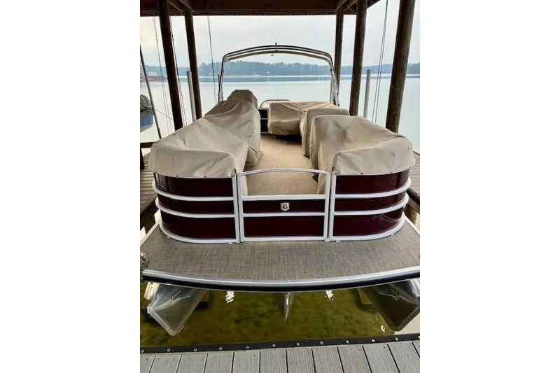 Slide: The Image of 2019 Godfrey Sweetwater pontoon boat docked with covered seating. - 8